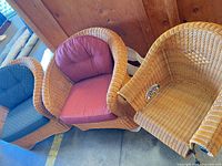 Three wicker armchairs side by side showing overall styles and two cushion colors