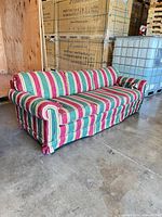 Full left-angle view of striped Thomasville sofa