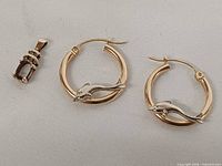 Front view of earrings and pendant