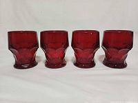 Front view showing four red Georgian pattern tumblers