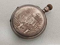 Embossed architectural scene on one side of 800 silver pocket watch