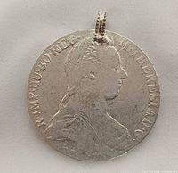 Obverse view of coin pendant showing Maria Theresa bust and bail