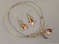 Choker necklace and earrings laid flat showing overall design