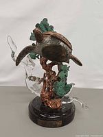 Front view showing turtle, seaweed, lucite water and base