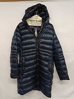 Front view of Atlantic Navy Canada Goose Cypress hooded puffer jacket on hanger