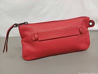 Front view showing Longchamp logo strap and zipper