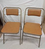 Front view of both Samsonite folding chairs showing seats and backrests