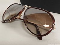 Front angled view of sunglasses showing frame style and lens tint