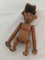 front view of teak monkey seated