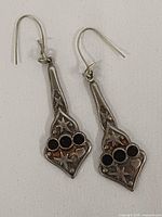 Front view of both earrings showing design details