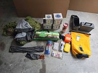 Overview of all camping items laid out on floor