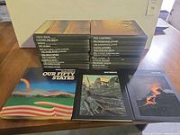 Two stacks of Time-Life The American Wilderness books plus three National Geographic titles displayed front