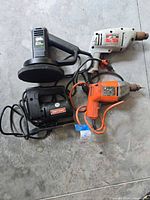 Group of four corded power tools laid out