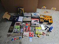 Entire lot laid out showing major boxed items, organizers and loose hardware