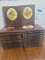 Full set of Time-Life Old West books stacked; two volumes displayed upright