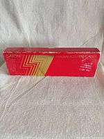 Closed red box front showing Eaton branding and wear