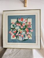 Front view of framed needlepoint showing entire artwork and frame