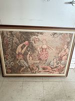 Full view of framed tapestry showing pastoral scene and frame