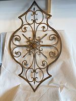 Full view of wrought iron wall art showing overall design and shape
