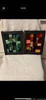 Both stained glass panels side by side in frames