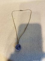 Full view of necklace displaying chain and pendant