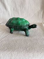 Full side view of green malachite glass turtle box