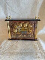 Front view showing floral automaton mechanism and gold columns