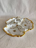 Top view showing tri-section form, gold gilt, center handle