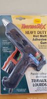 Front view of sealed ThermoStix glue gun in retail package