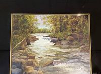 Front view of framed print showing river landscape scene