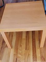Top view of square Ikea Lack table showing veneer condition
