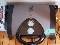 Top view of closed George Foreman grill showing logo and dial