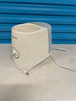 Right-front angle view of entire humidifier showing tank and cord