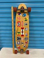 Full view of complete longboard with yardstick for scale