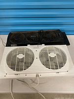 Both window fans side by side