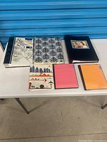 All six photo albums laid out on table