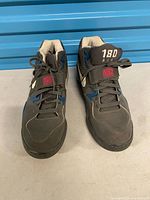 Top view of both Nike Air Force 180 sneakers showing laces, tongues, and toe boxes