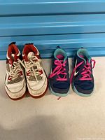 Front view showing both sneaker pairs side by side