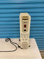 Full heater showing fins, cord, base and overall wear