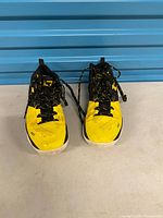 Front view of both shoes showing colorway, laces and wear