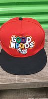 Front view showing Good Moods embroidery and black brim