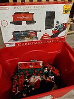 Box front showing Holiday Express 18-Piece Train Set branding and price tag