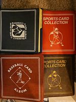 Four binders labelled Baseball Card Album and Sports Card Collection
