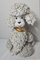 Front view of ceramic French poodle figurine