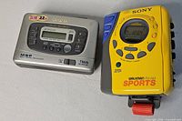 Front view of both Sony Walkman Sports and Aiwa TX676 units