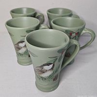 Five Pfaltzgraff Winterwood mugs grouped