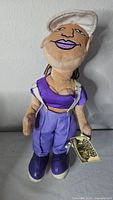 Front view of Homies Flygirl plush showing outfit, tag, and overall condition