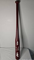 Full view of the maroon 31" wooden bat