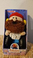 Front view of boxed Yukon Cornelius animated plush
