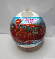 Full view of ornament showing Christmas 1996 text and train graphic